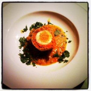 Vegetarian Scotch Eggs, served with spiced lentils