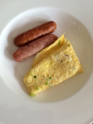 Breakfast: Sausages and spring onion omelette